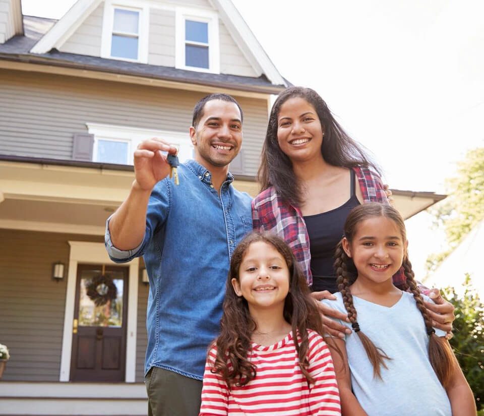 Cheerful Family Against House